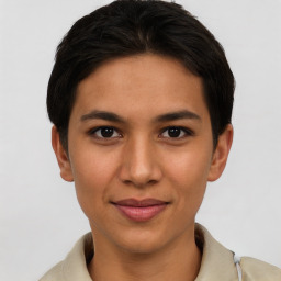 Joyful asian young-adult female with short  brown hair and brown eyes