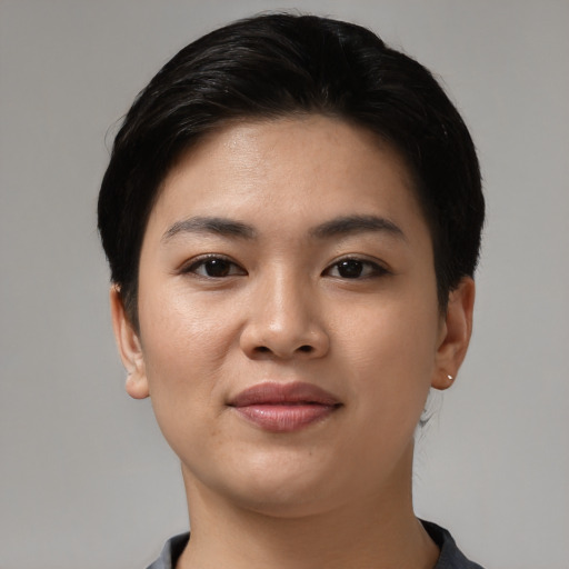 Joyful latino young-adult female with short  black hair and brown eyes
