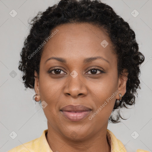 Joyful latino adult female with short  brown hair and brown eyes