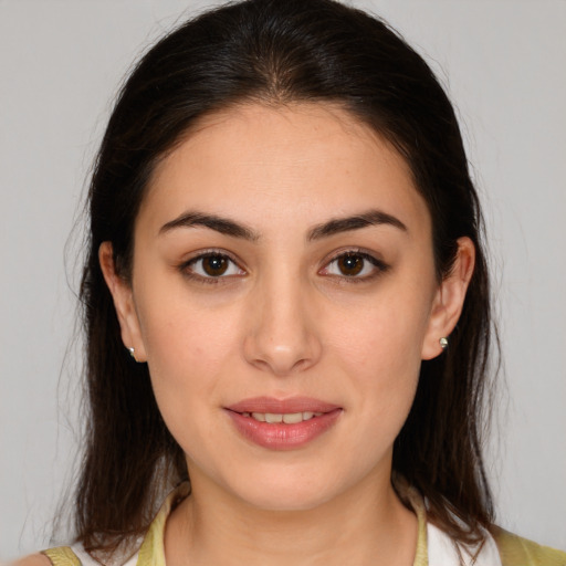 Joyful white young-adult female with medium  brown hair and brown eyes