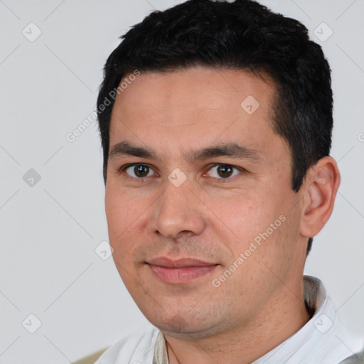 Joyful white young-adult male with short  black hair and brown eyes