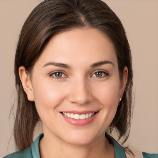 Joyful white young-adult female with medium  brown hair and brown eyes