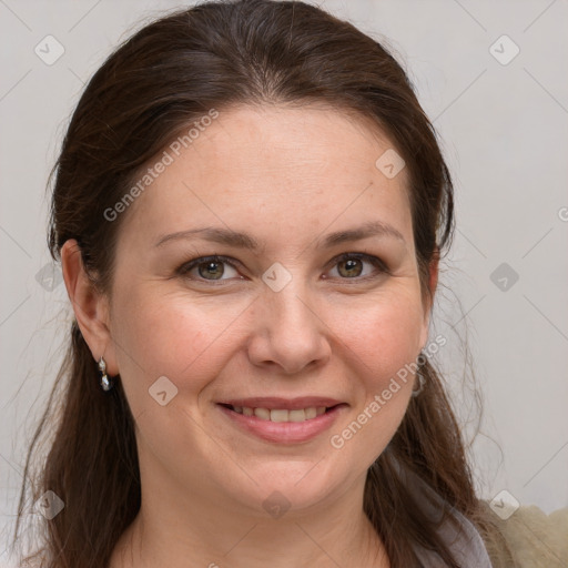 Joyful white adult female with medium  brown hair and grey eyes