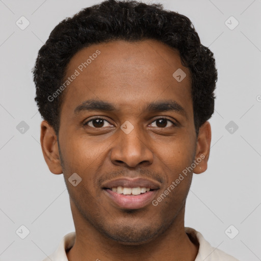 Joyful black young-adult male with short  brown hair and brown eyes