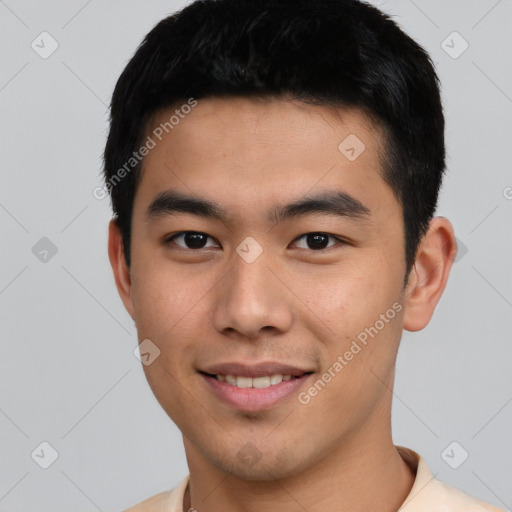 Joyful asian young-adult male with short  black hair and brown eyes