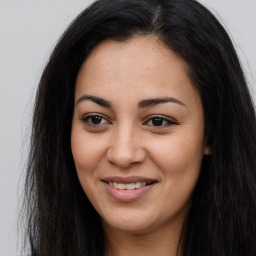 Joyful asian young-adult female with long  brown hair and brown eyes