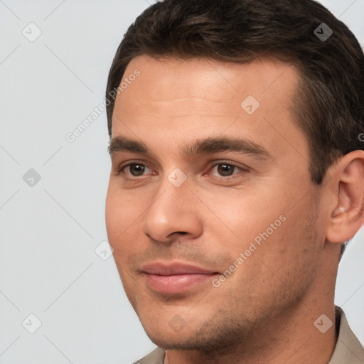 Joyful white young-adult male with short  brown hair and brown eyes