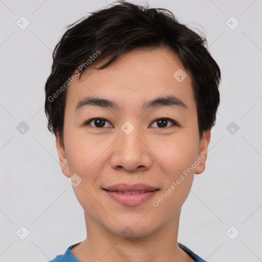 Joyful asian young-adult male with short  brown hair and brown eyes