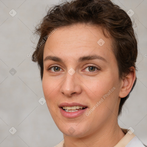 Joyful white adult female with short  brown hair and brown eyes