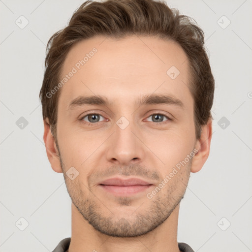 Joyful white young-adult male with short  brown hair and grey eyes