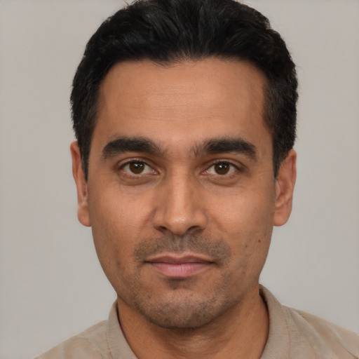 Neutral latino young-adult male with short  black hair and brown eyes
