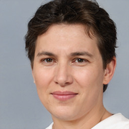 Joyful white adult female with short  brown hair and brown eyes