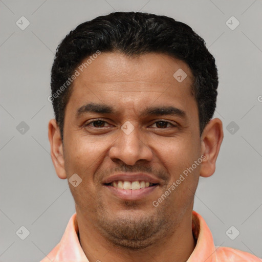 Joyful latino young-adult male with short  black hair and brown eyes