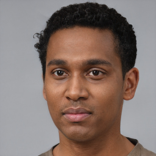 Neutral black young-adult male with short  black hair and brown eyes