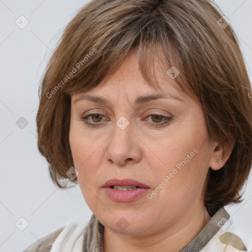 Joyful white adult female with medium  brown hair and brown eyes