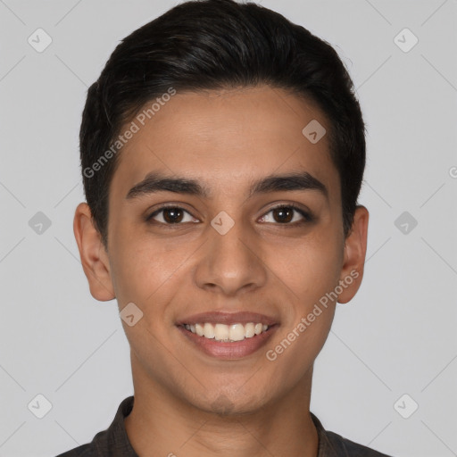 Joyful latino young-adult male with short  brown hair and brown eyes