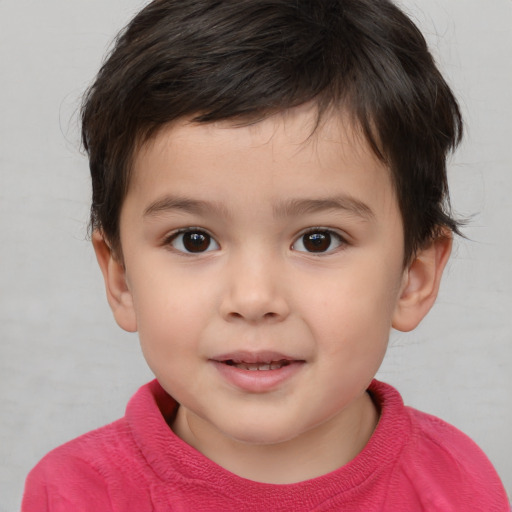 Joyful white child male with short  brown hair and brown eyes