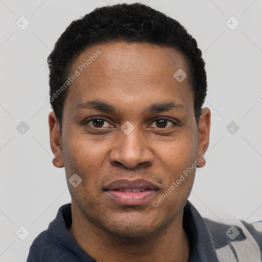 Joyful black young-adult male with short  black hair and brown eyes