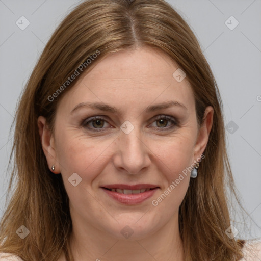 Joyful white adult female with long  brown hair and grey eyes