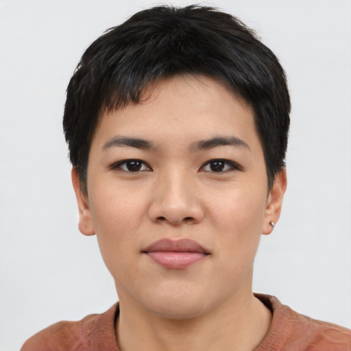 Joyful asian young-adult female with short  black hair and brown eyes