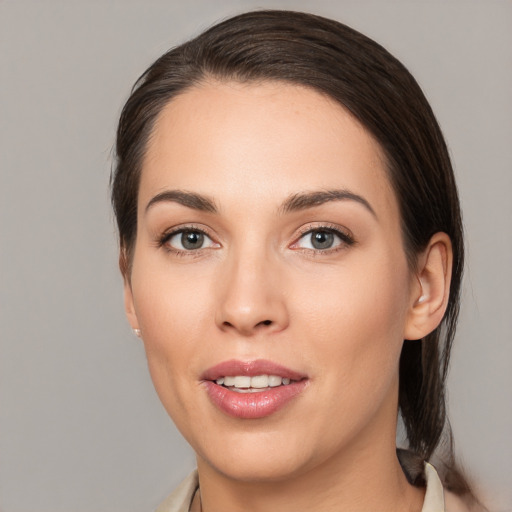 Joyful white young-adult female with medium  brown hair and brown eyes