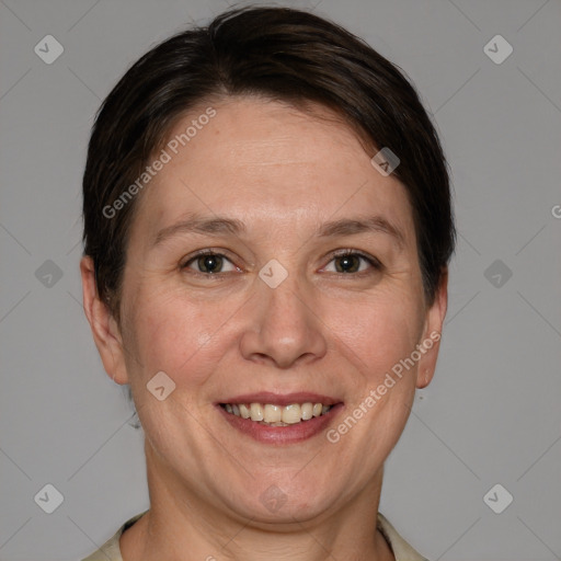 Joyful white adult female with short  brown hair and grey eyes