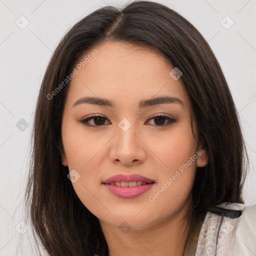 Joyful asian young-adult female with long  brown hair and brown eyes