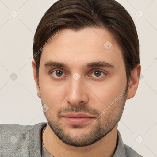 Neutral white young-adult male with short  brown hair and brown eyes