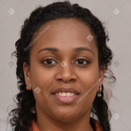 Joyful black young-adult female with long  brown hair and brown eyes