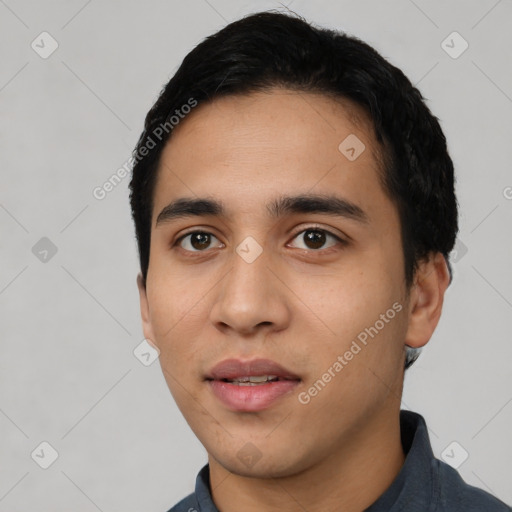 Neutral latino young-adult male with short  black hair and brown eyes