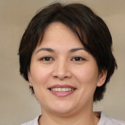 Joyful white adult female with medium  brown hair and brown eyes