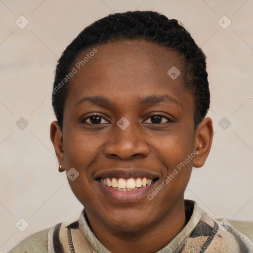 Joyful black young-adult female with short  black hair and brown eyes