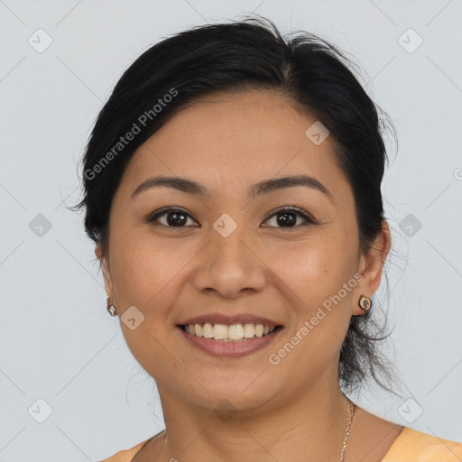 Joyful latino young-adult female with medium  brown hair and brown eyes