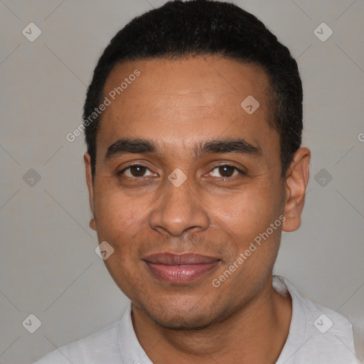 Joyful latino young-adult male with short  black hair and brown eyes