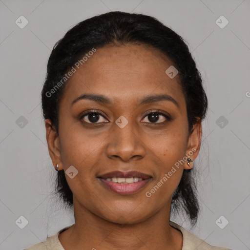 Joyful black young-adult female with short  black hair and brown eyes