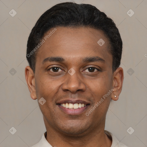 Joyful latino young-adult male with short  black hair and brown eyes