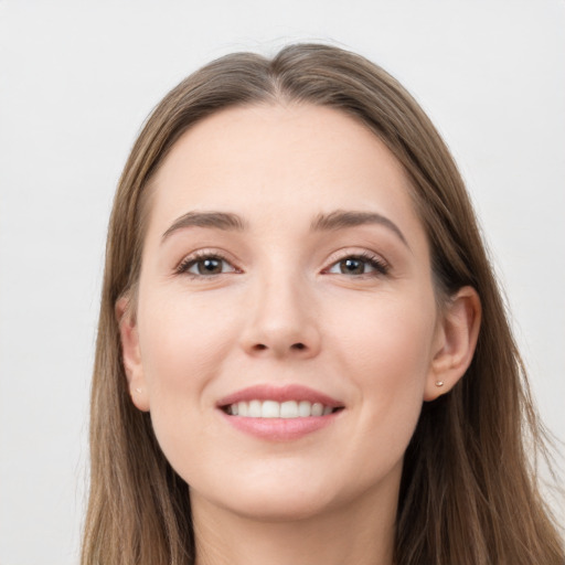 Joyful white young-adult female with long  brown hair and grey eyes