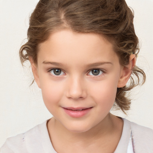 Joyful white child female with medium  brown hair and brown eyes