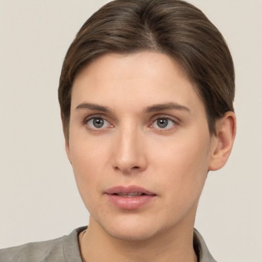 Neutral white young-adult female with short  brown hair and brown eyes