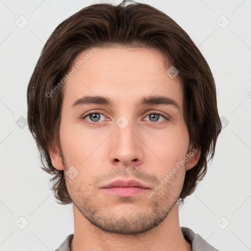 Neutral white young-adult male with short  brown hair and brown eyes