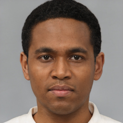 Neutral latino young-adult male with short  brown hair and brown eyes