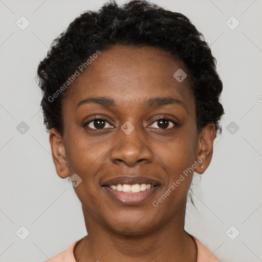 Joyful black young-adult female with short  brown hair and brown eyes