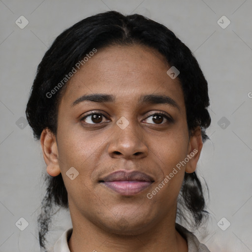 Joyful black young-adult female with short  black hair and brown eyes