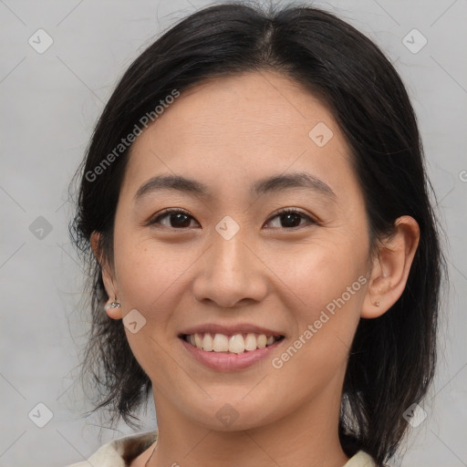 Joyful latino young-adult female with medium  brown hair and brown eyes