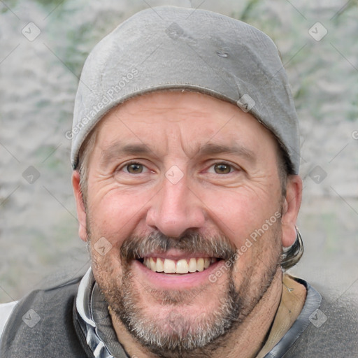 Joyful white adult male with short  brown hair and grey eyes