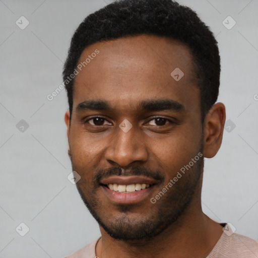 Joyful black young-adult male with short  black hair and brown eyes