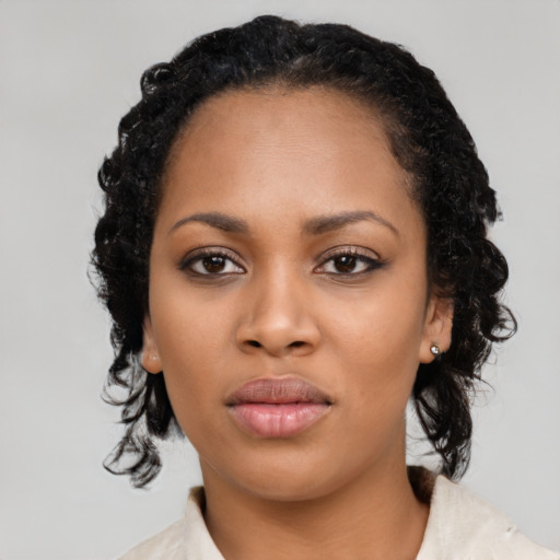 Neutral black young-adult female with medium  black hair and brown eyes