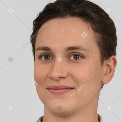 Joyful white young-adult female with short  brown hair and brown eyes