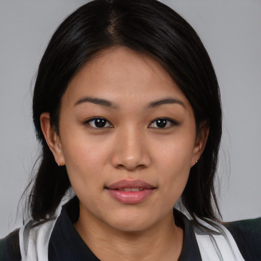 Joyful white young-adult female with medium  black hair and brown eyes