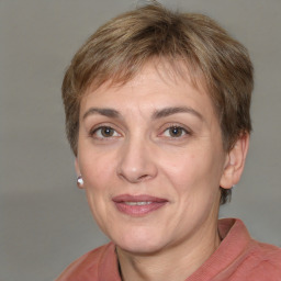 Joyful white adult female with short  brown hair and grey eyes